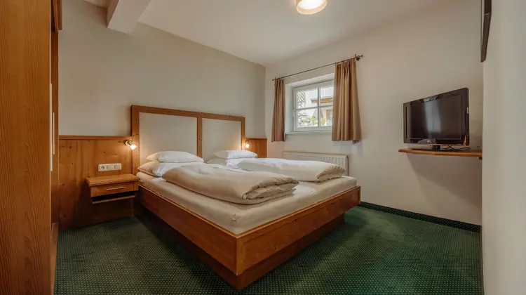 hotel room with television in traditional Austrian style